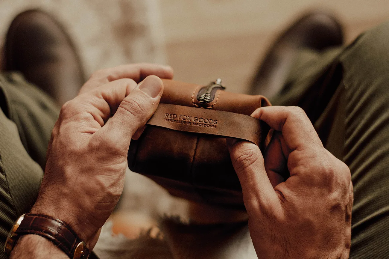 Craftsman working on Red Fox Goods leather products